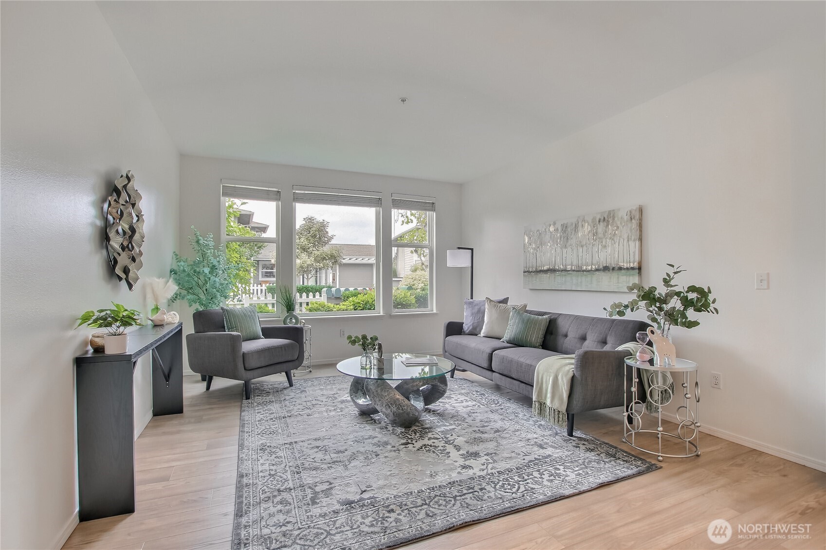 Light and bright living area with high ceilings and large windows.