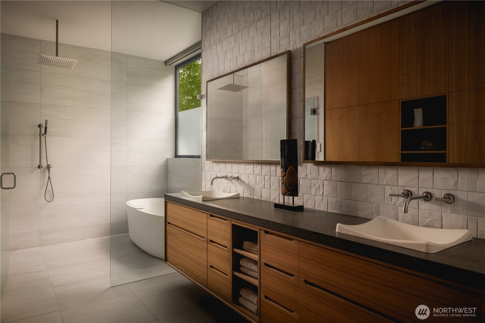 A wet room layout brings tub and shower into a single, continuous space, layered with warm walnut and texture.