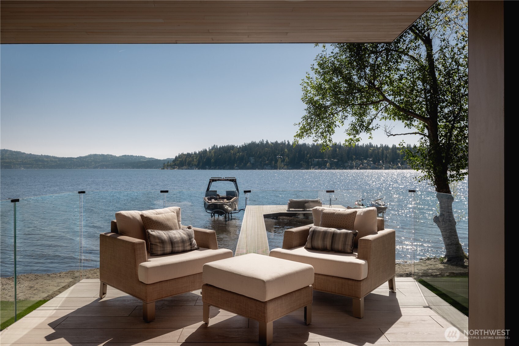 The terrace settles at the water’s edge, where the shoreline experience begins.