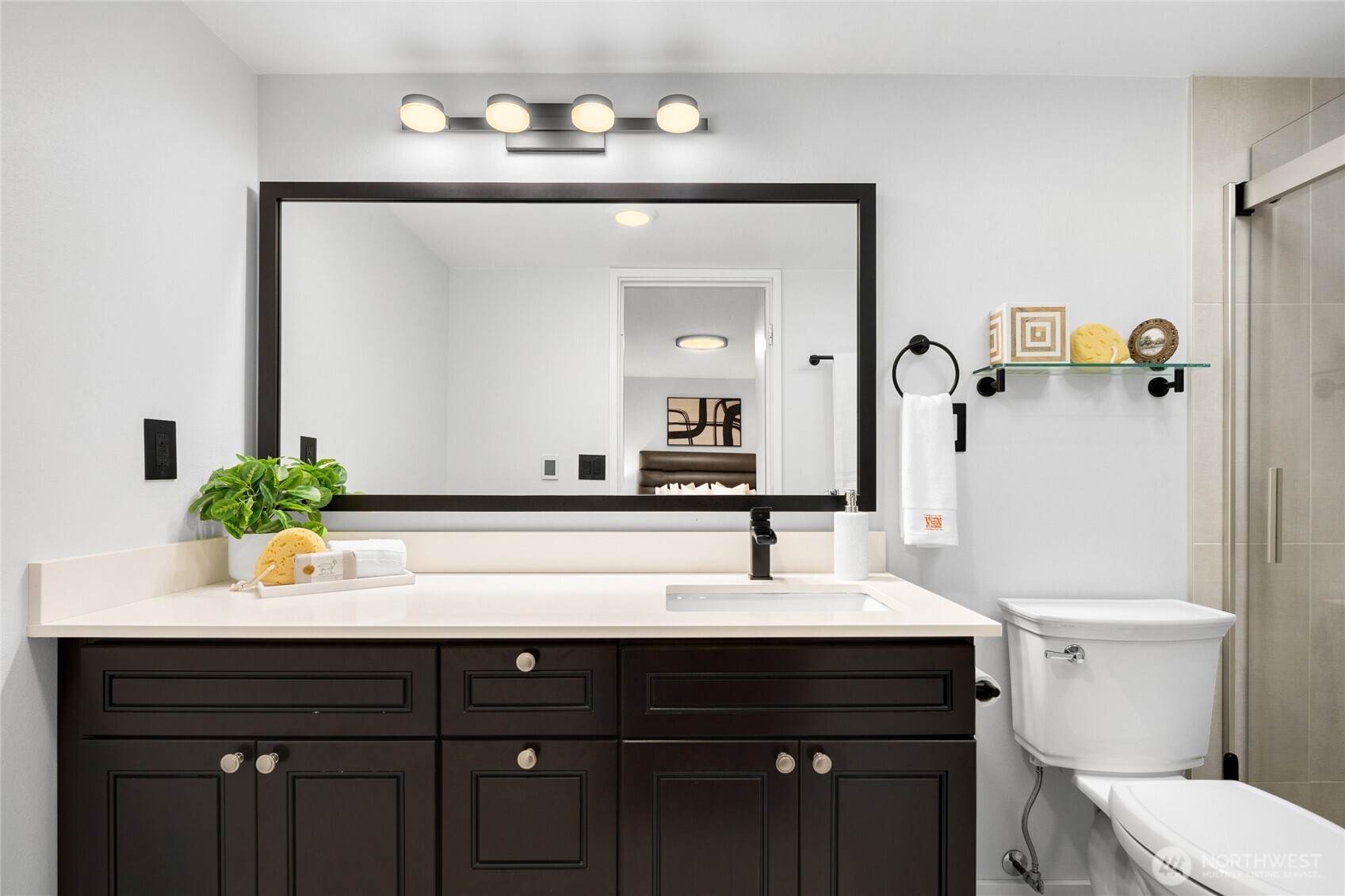 Updated primary bathroom with modern finishes.