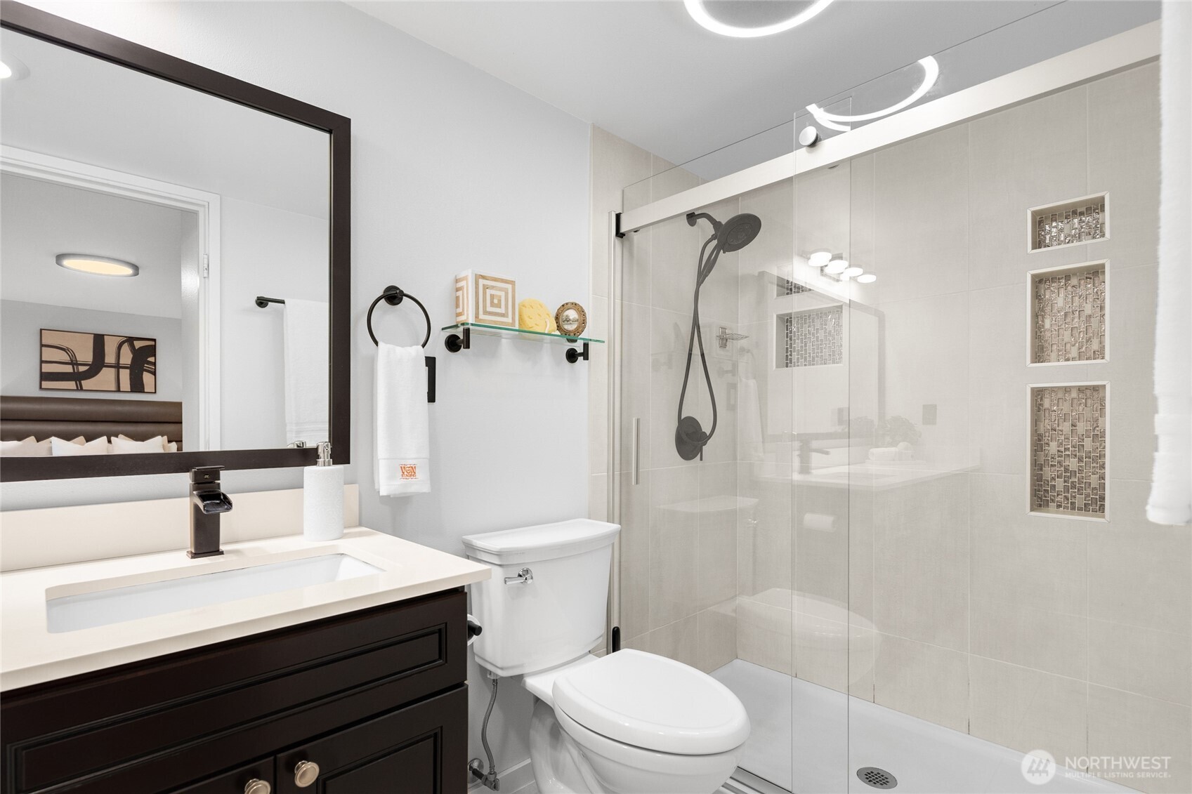 Beautifully tiled primary shower with heated tile throughout.