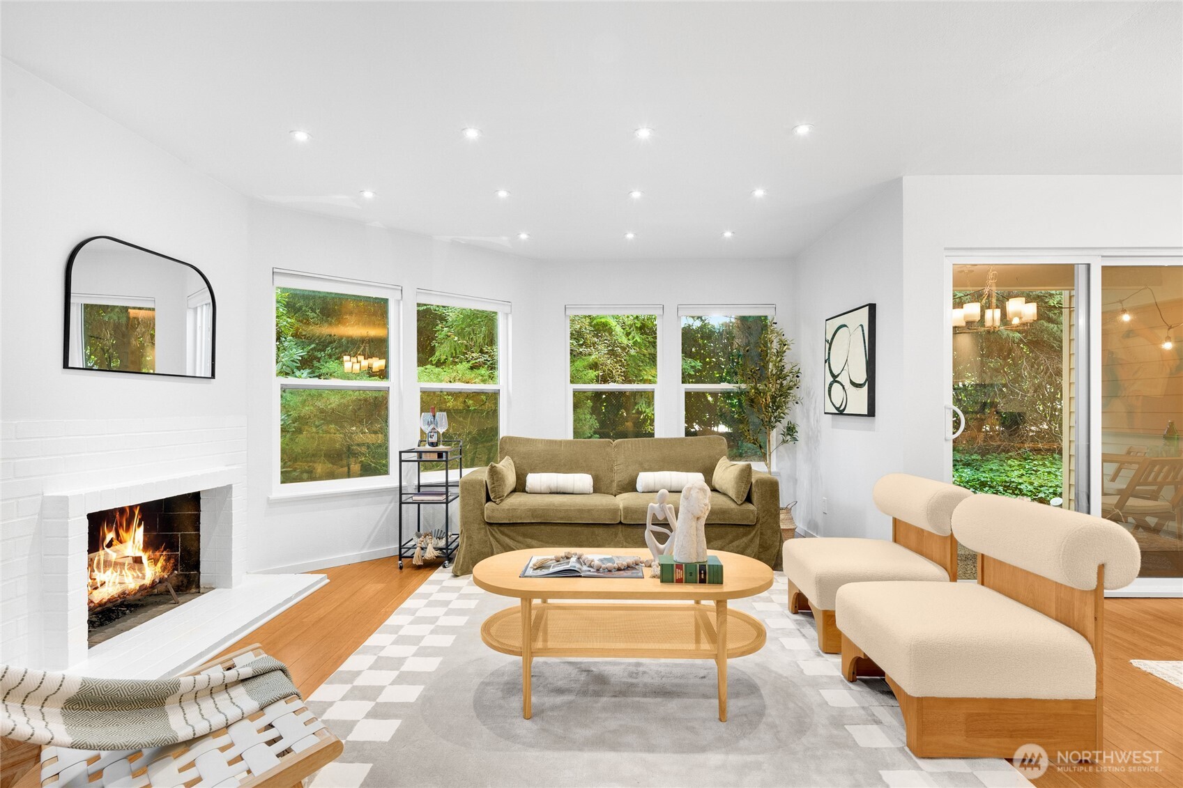 Wood burning fireplace anchors the living room and heats the place during cooler months.