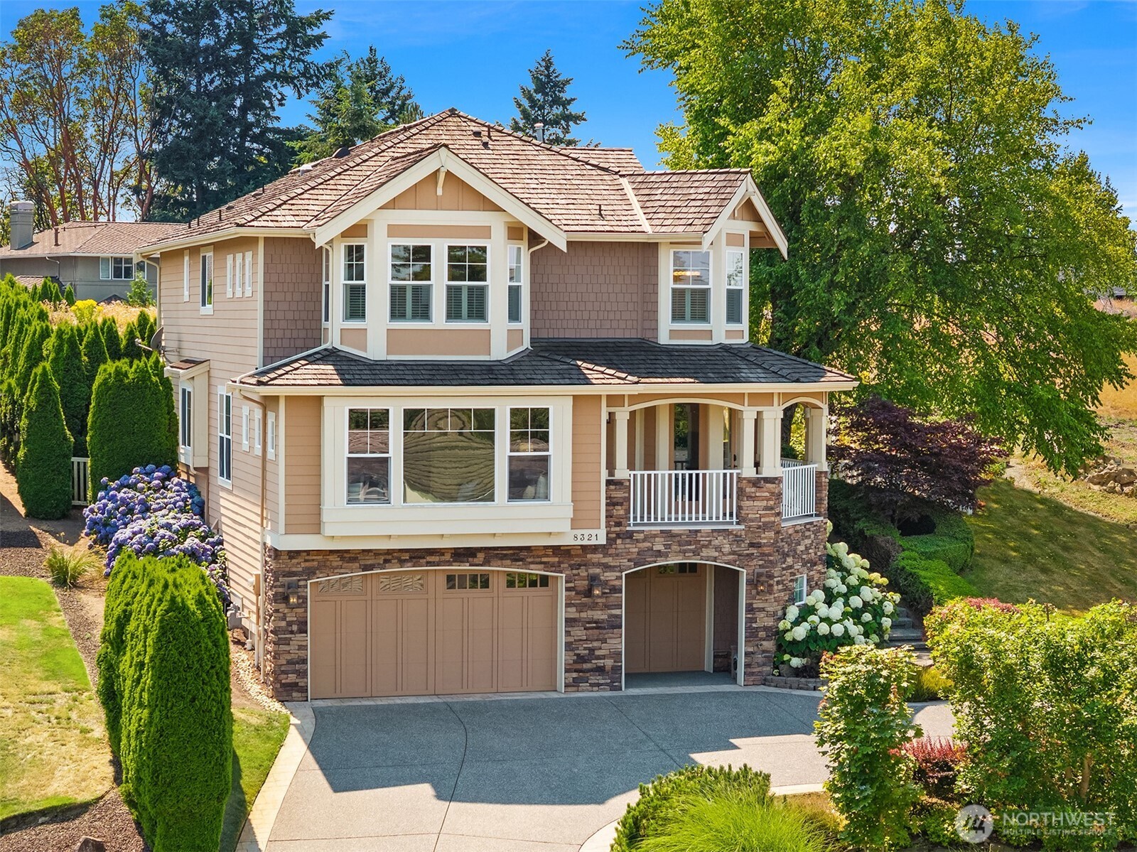 Timeless Pacific Northwest Craftsman architecture showcases exceptional curb appeal, enduring quality, and meticulous maintenance in one of Newcastle's premier hilltop neighborhoods.