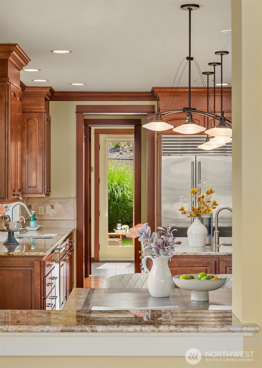 Thoughtfully designed sightlines connect the kitchen, casual dining area, and outdoor living spaces, creating an effortless rhythm for everyday life.