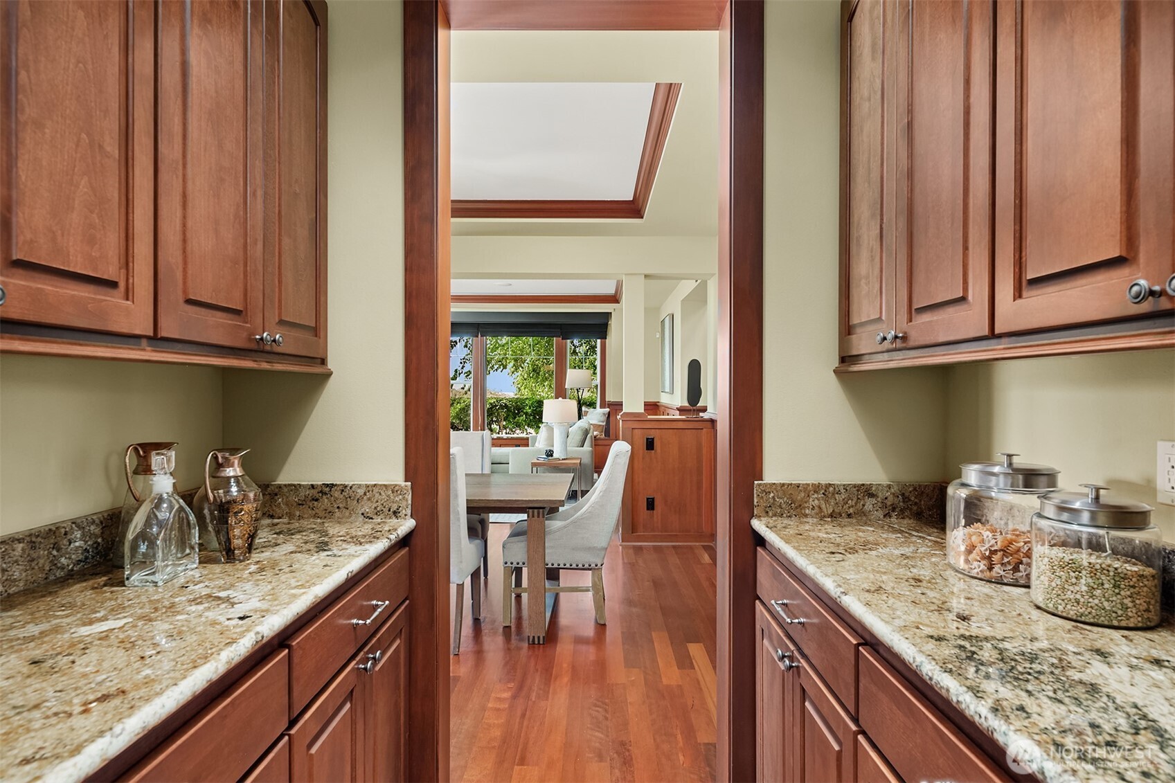 An expansive walk-in pantry offers exceptional storage and organization, keeping the kitchen beautifully equipped yet effortlessly uncluttered.