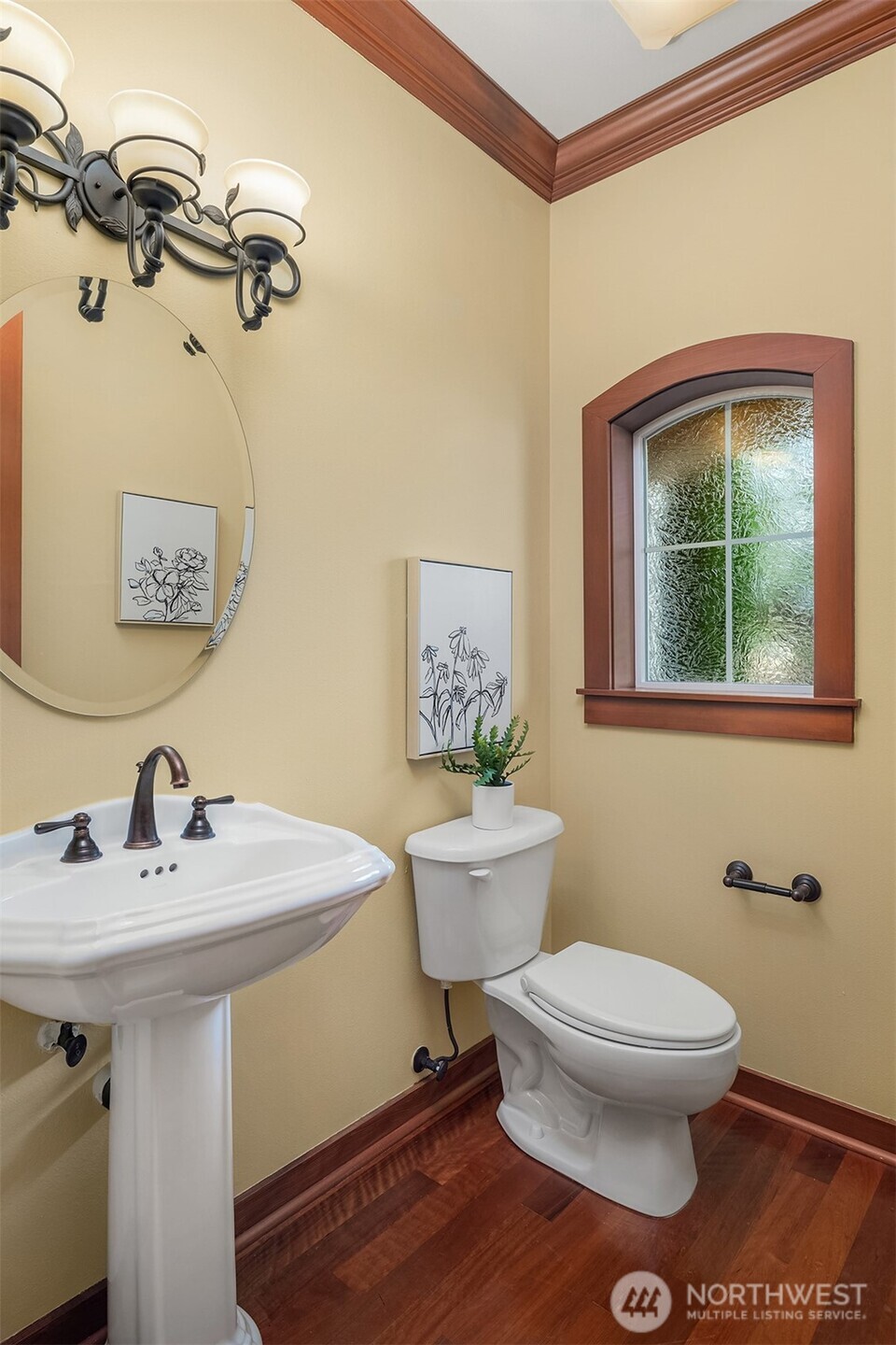 Conveniently located on the main level, the powder room pairs timeless finishes with classic design.