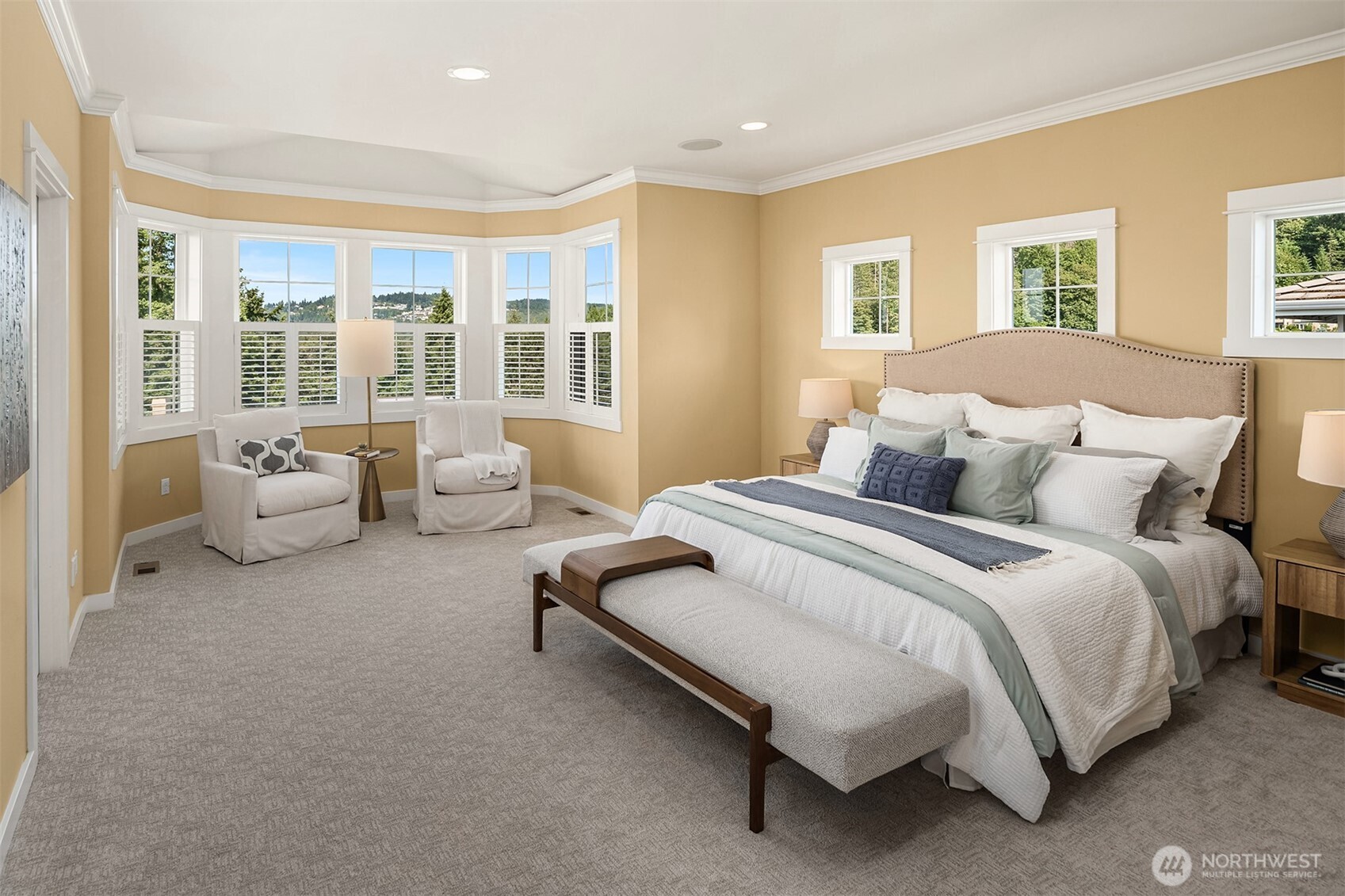 A luxurious escape featuring generous proportions, peaceful views, and a quiet sitting alcove perfect for morning coffee or evening reading.