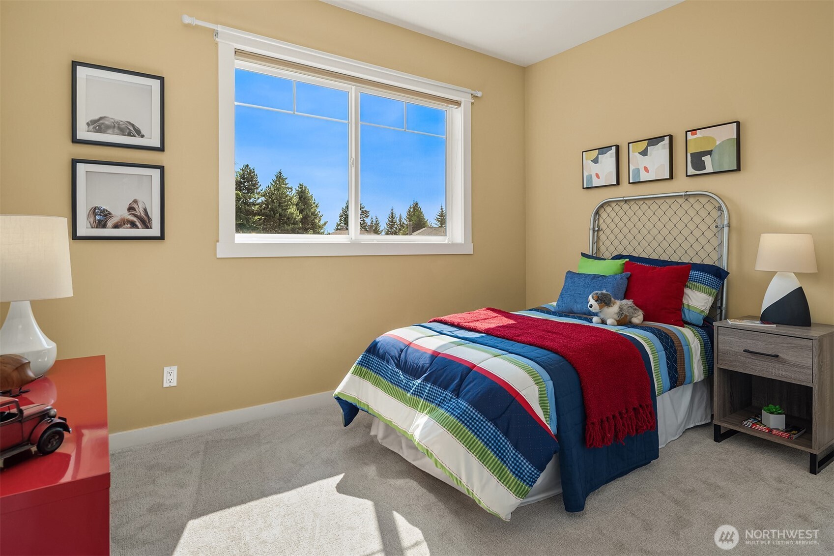 Large windows welcome natural light while creating a bright, comfortable retreat designed to grow with every stage of life.