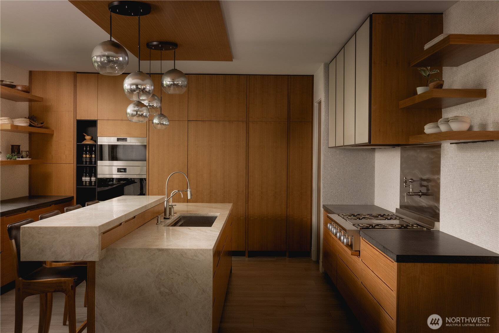 The kitchen is shaped by a carefully considered material palette.
