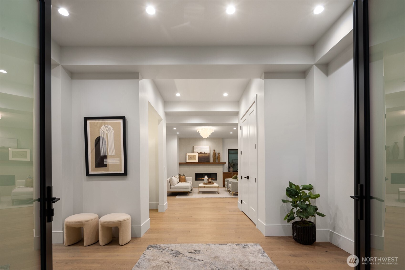 A substantial double-door entry sets the stage for this one-of-a-kind architectural residence.