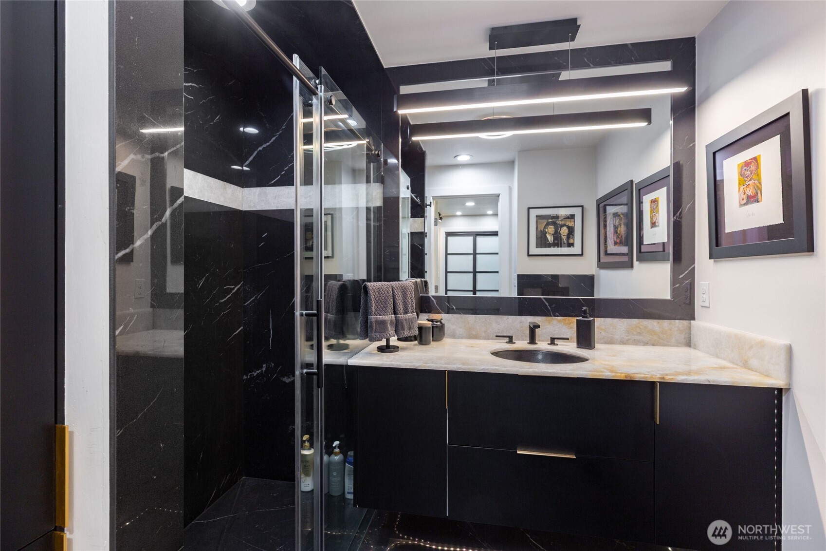 Remodeled laundry room with custom cabinetry, stone counters, thoughtfully designed for style and function.