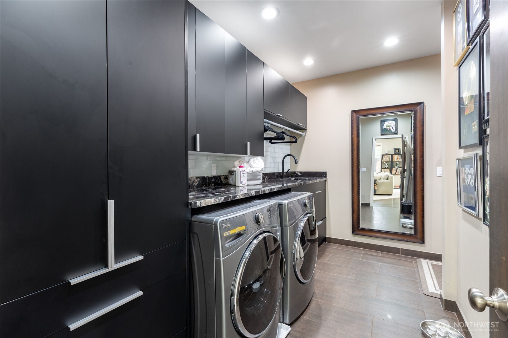 Dramatic entry with soaring ceilings and expansive windows for abundant natural light.