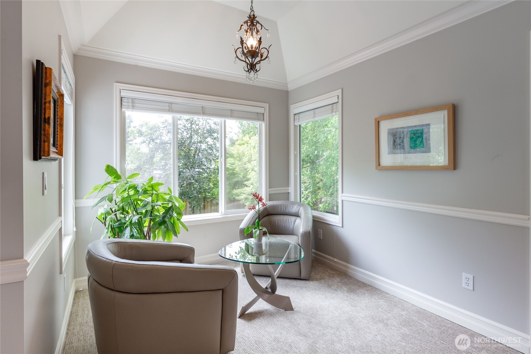 Spacious primary bath featuring dual vanity, oversized mirror, soaking tub, and separate glass-enclosed shower.