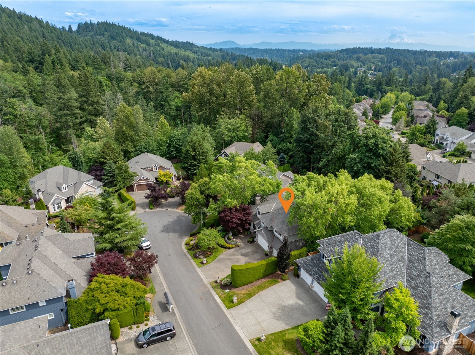 “Tucked into a peaceful cul-de-sac, this home offers privacy and a tranquil setting surrounded by mature trees.”