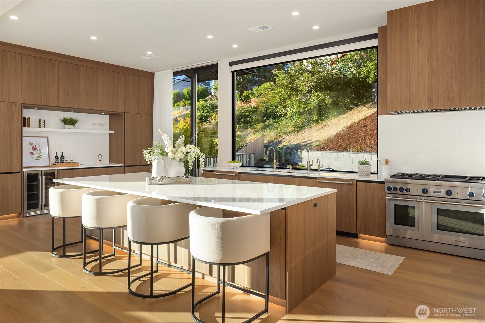 Stunning kitchen with Cabria quartz surfaces & Thermador + Wolf appliances