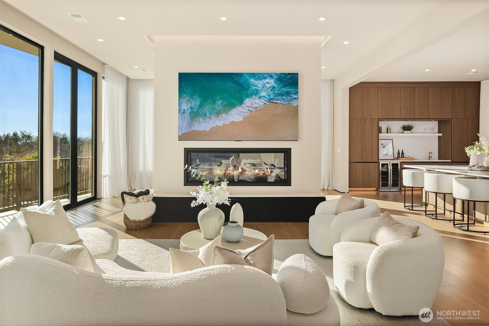 Main floor living room featuring a glass Napoleon fireplace