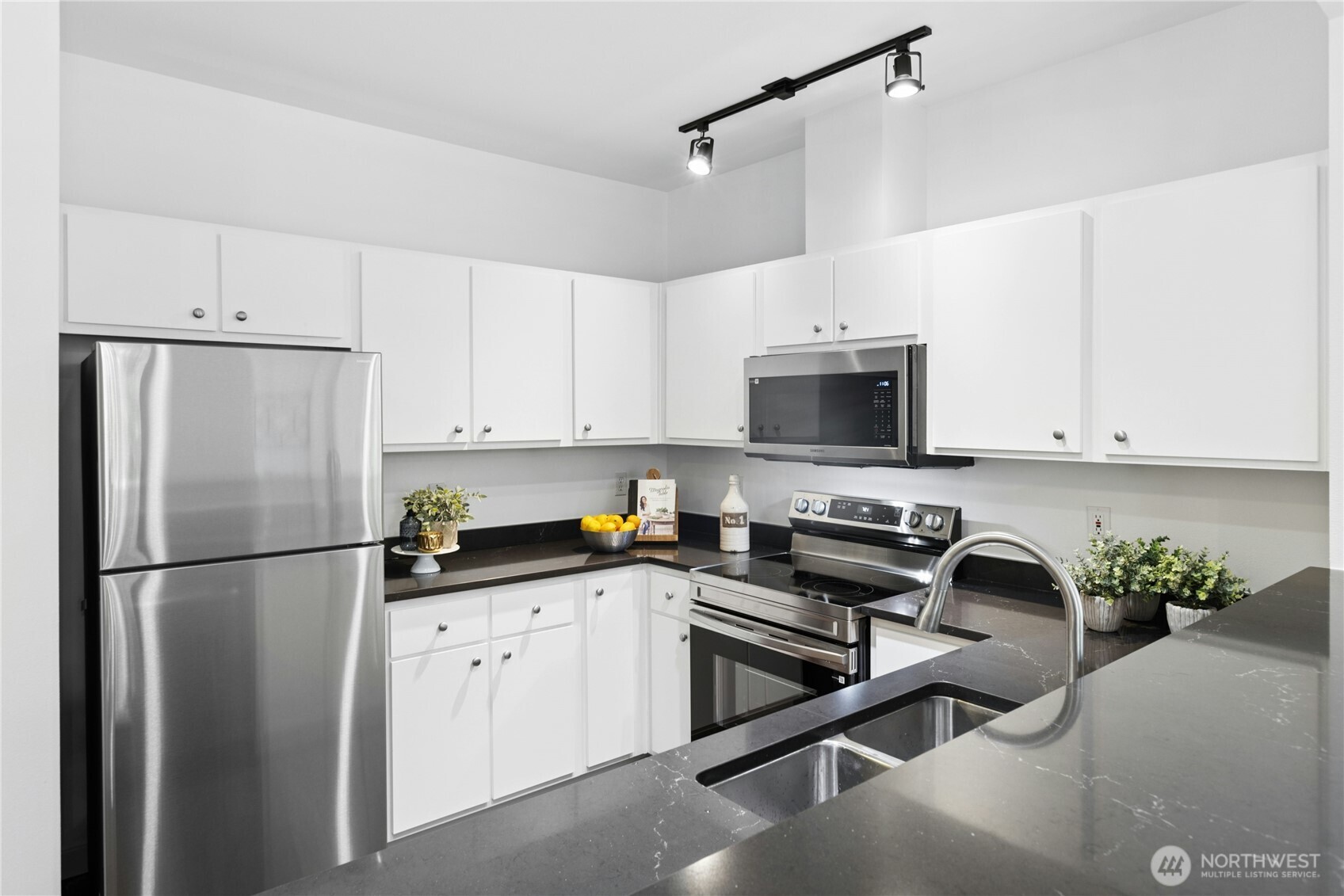 Functional kitchen layout with double sink and extensive workspace