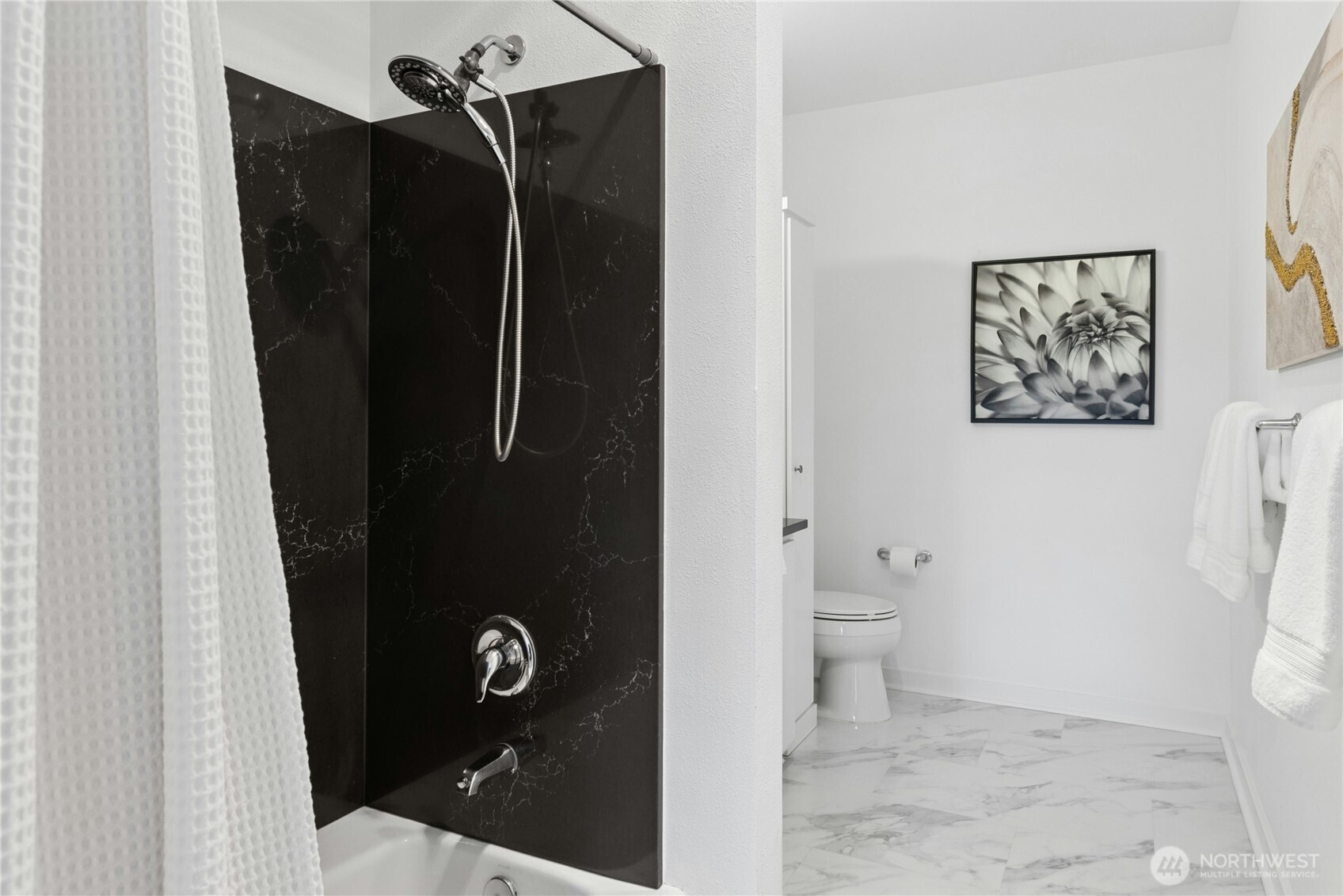 Primary bedroom features a private bath and walk-in closet