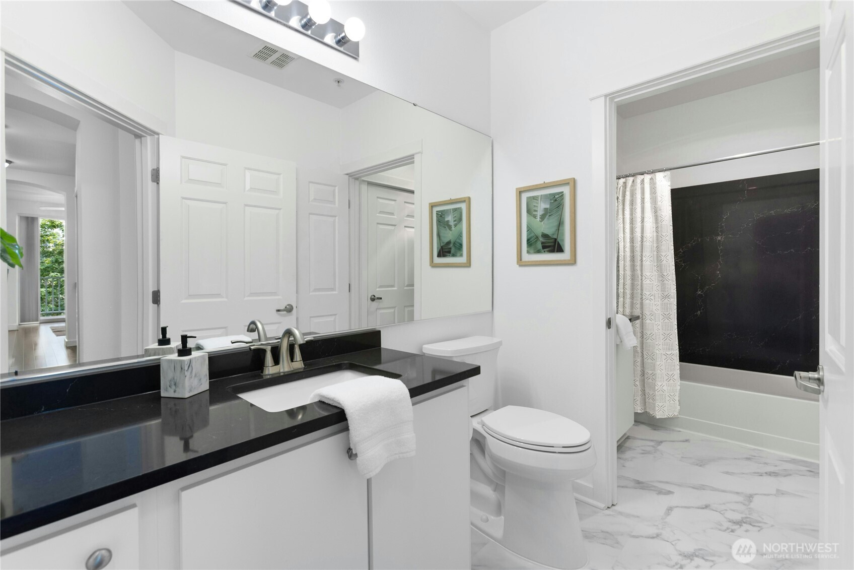Secondary bathroom, locks off for privacy from guest use.