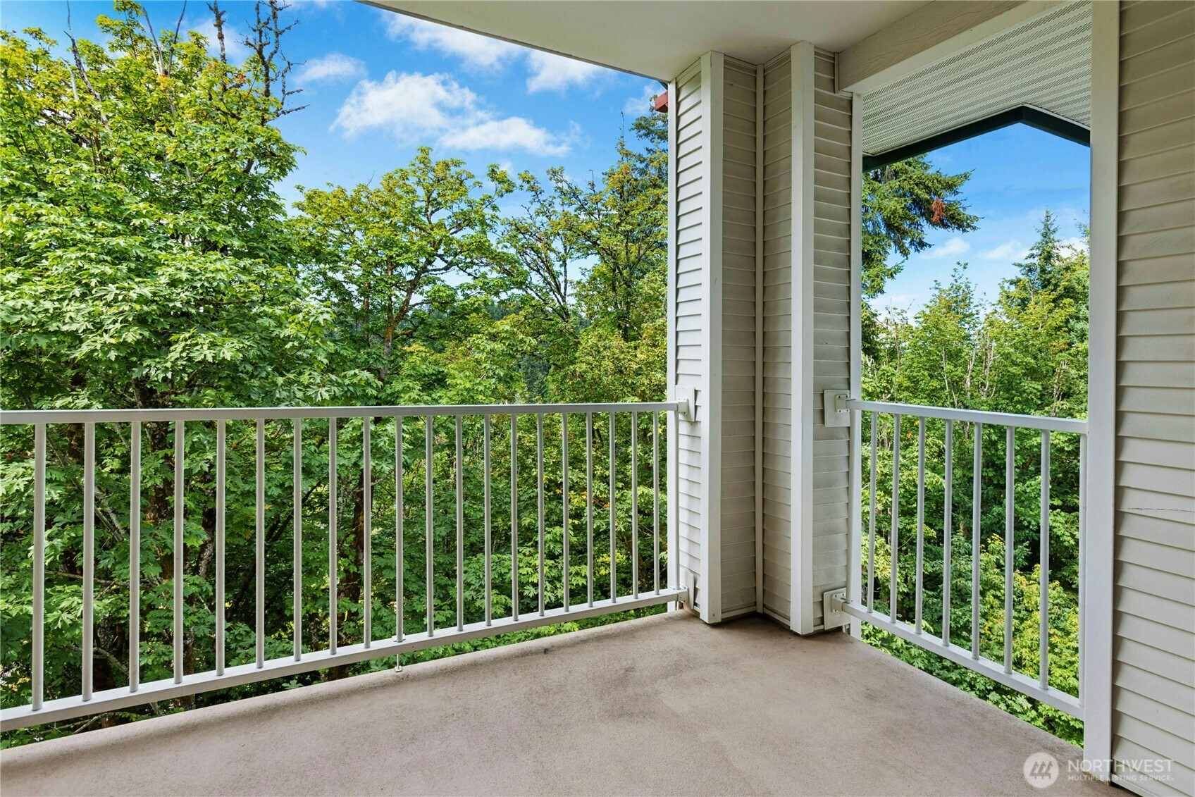 Private top-floor balcony offers a peaceful setting for morning coffee or relaxing