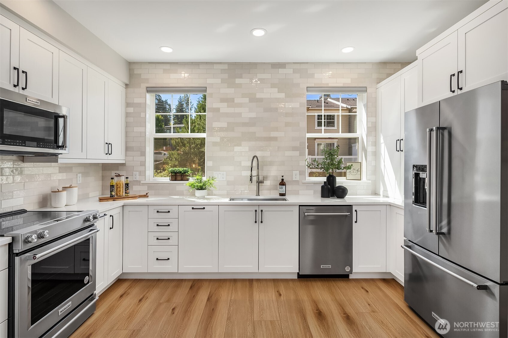 Simply gorgeous tile backsplash all the way to the ceiling and remote control blinds for easy, hassle free light control when you need it.