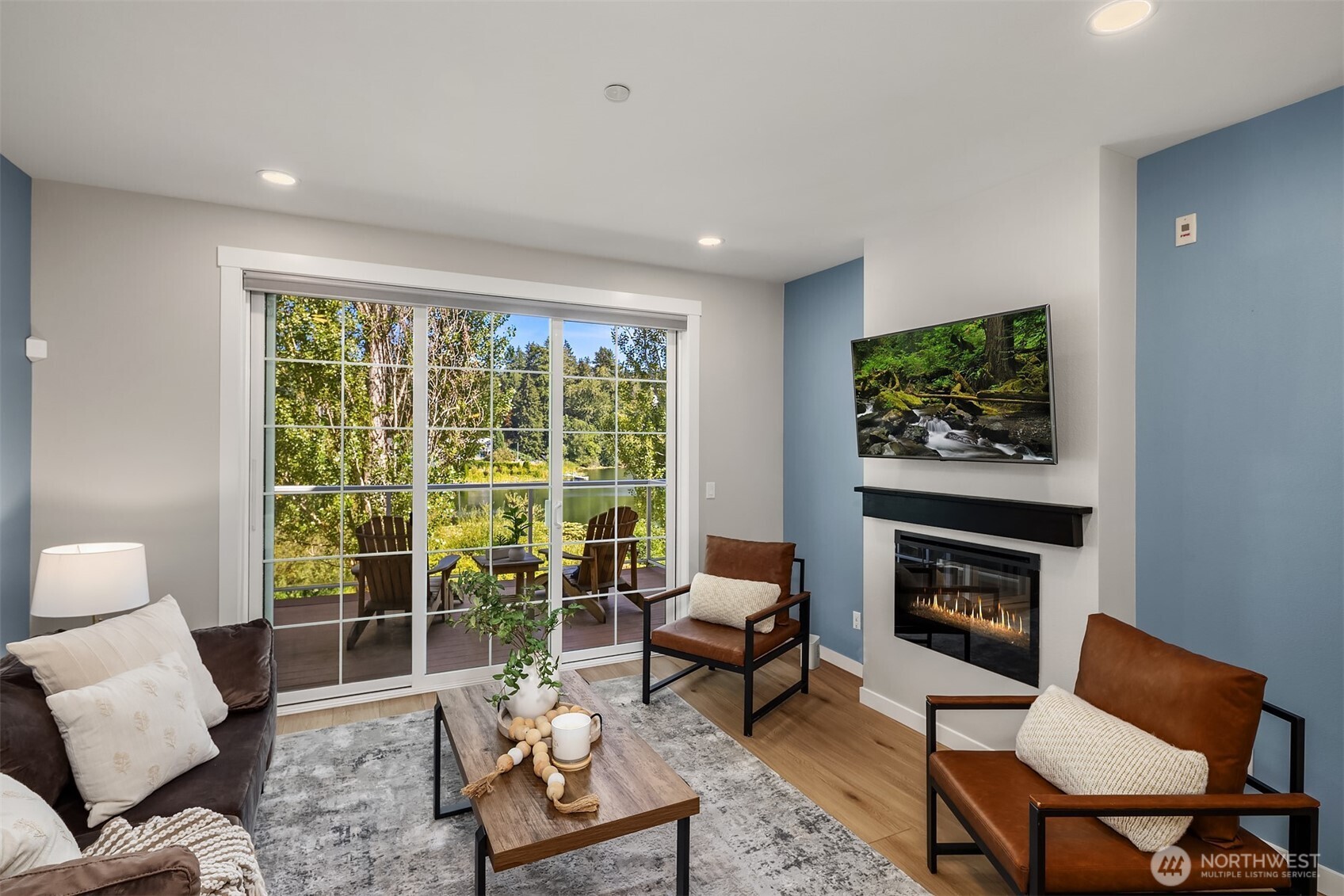 Electric fireplace adds a cozy feeling. Enjoy Lake Boren views, sit and gather on the deck. TV and mount stay with the home.
