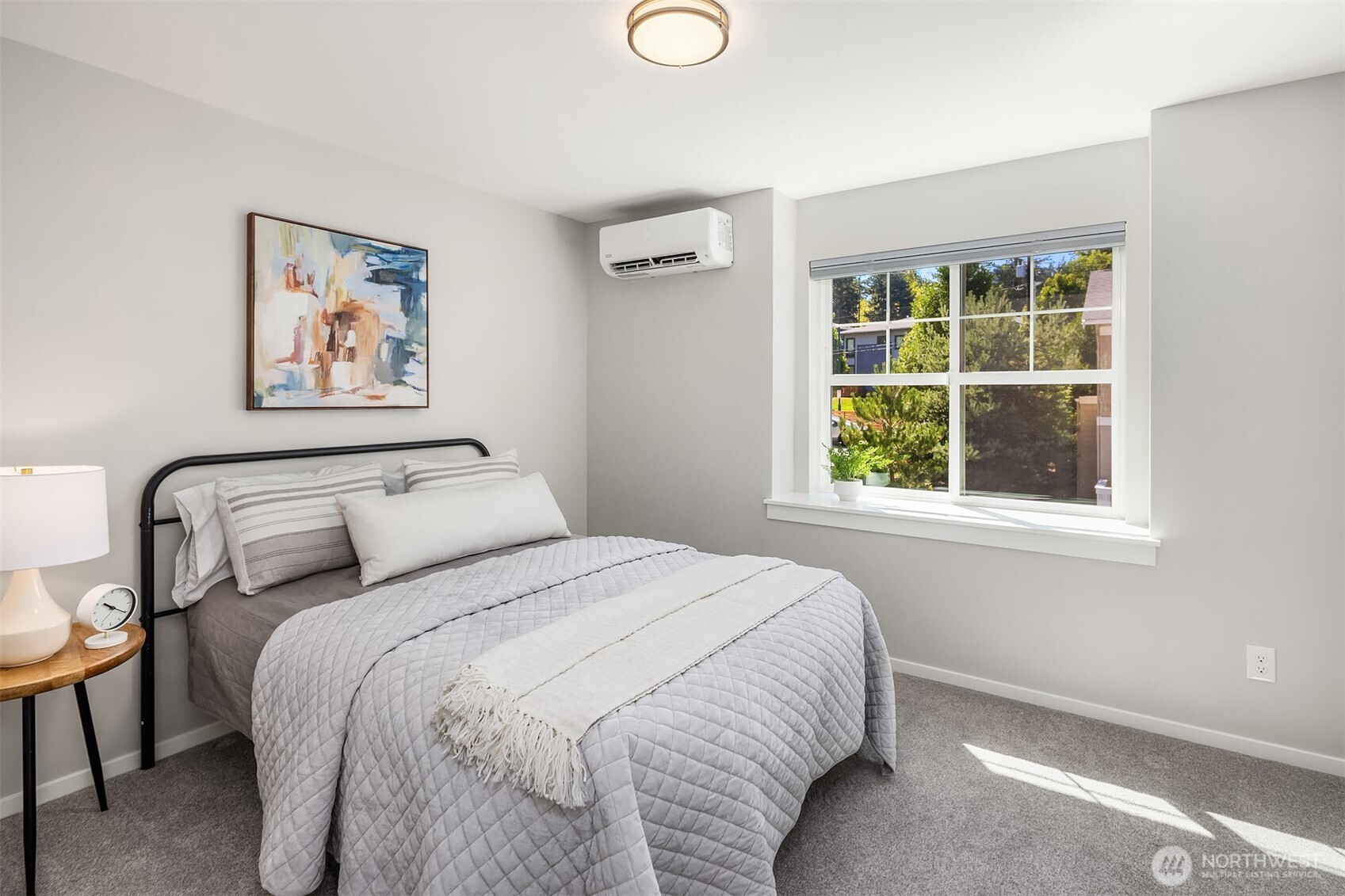 Guest bedroom at the front of the house, with a wonderful extra wide window sill. Such a cute feature.