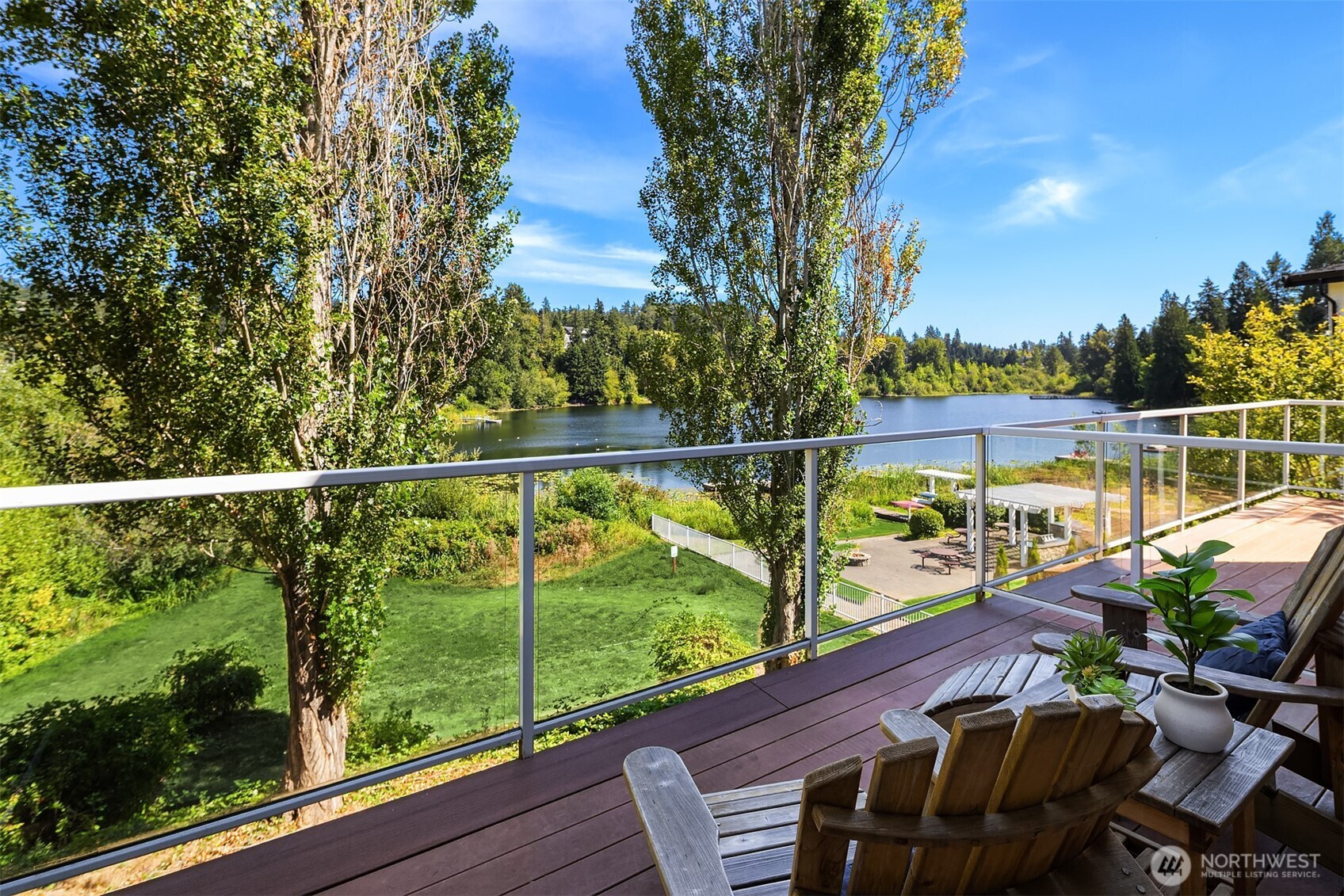 Glass railings ensures the view is maximized at all times. The community waterfront is just a few steps away complete with grills, covered seating, kayaks and more, all available for use by the residents of Lake Boren townhomes only