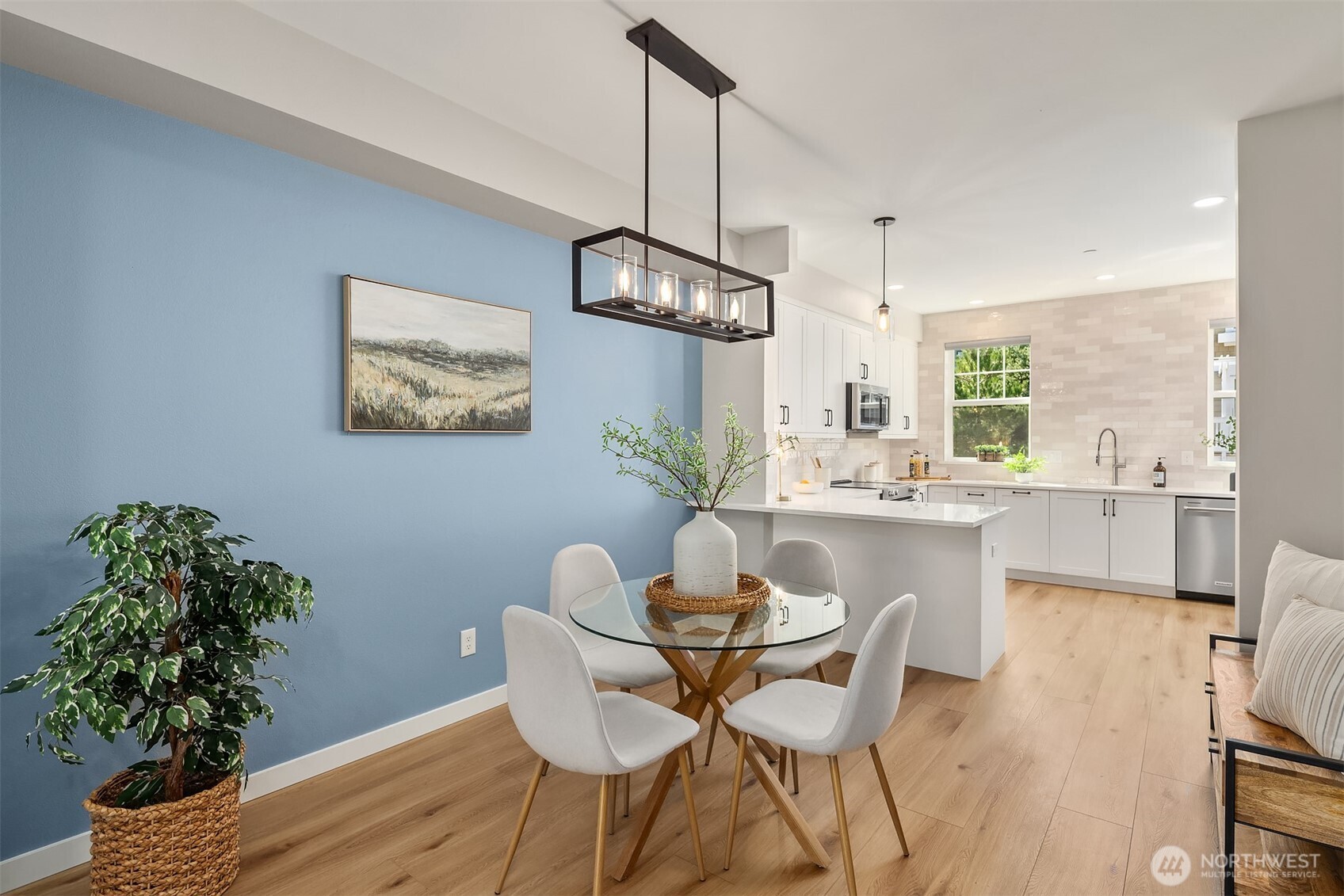 Open concept main floor living with new luxury vinyl plank flooring and a kitchen that will make you swoon
