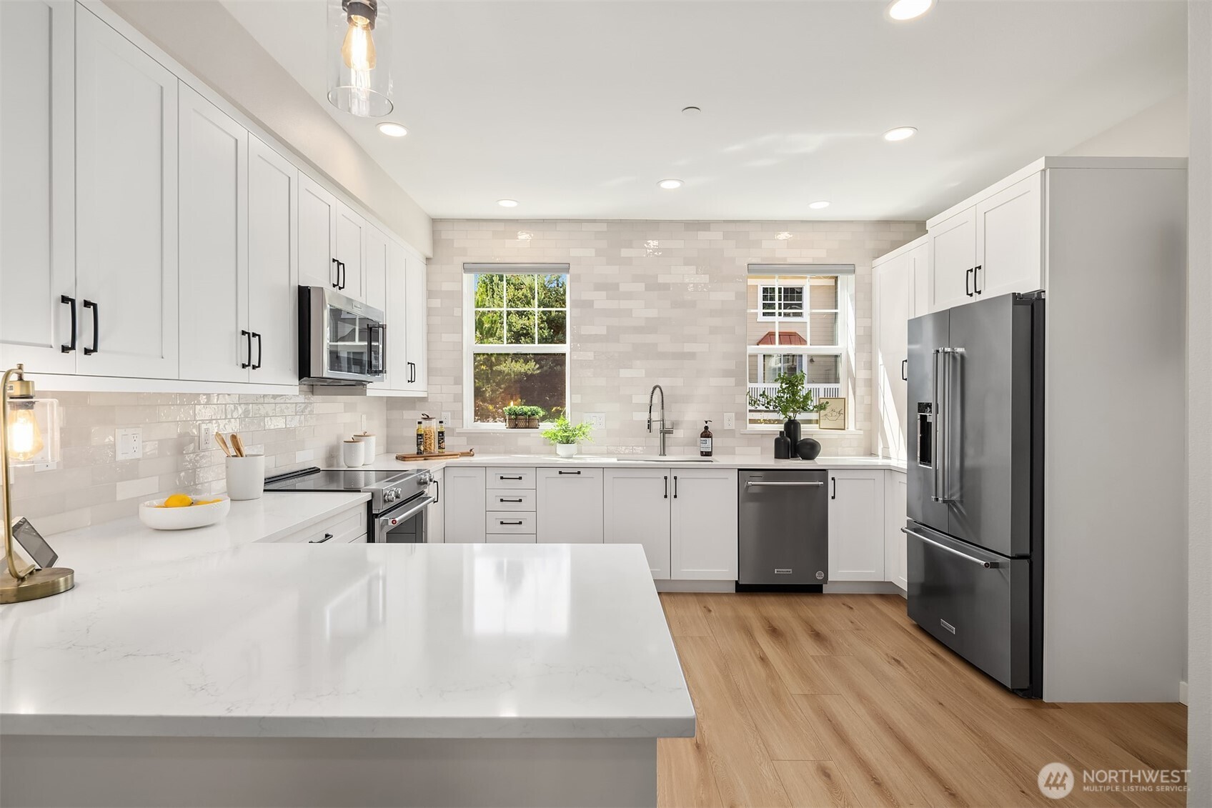 Jaw droppingly gorgeous remodeled kitchen. The footprint was expanded to give more space to cook and gather. Tile backsplash is carried all the way up to the ceiling - a design feature rarely seen in luxury homes, let alone condos