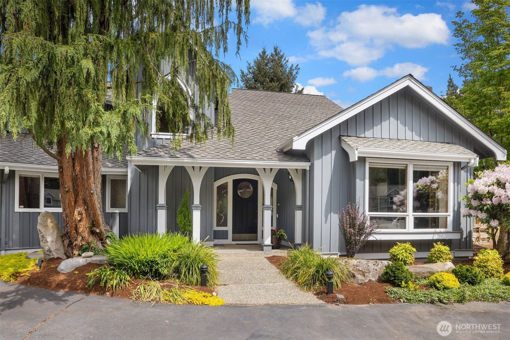 Elegant entrance, lots of room for guest parking and a three car garage