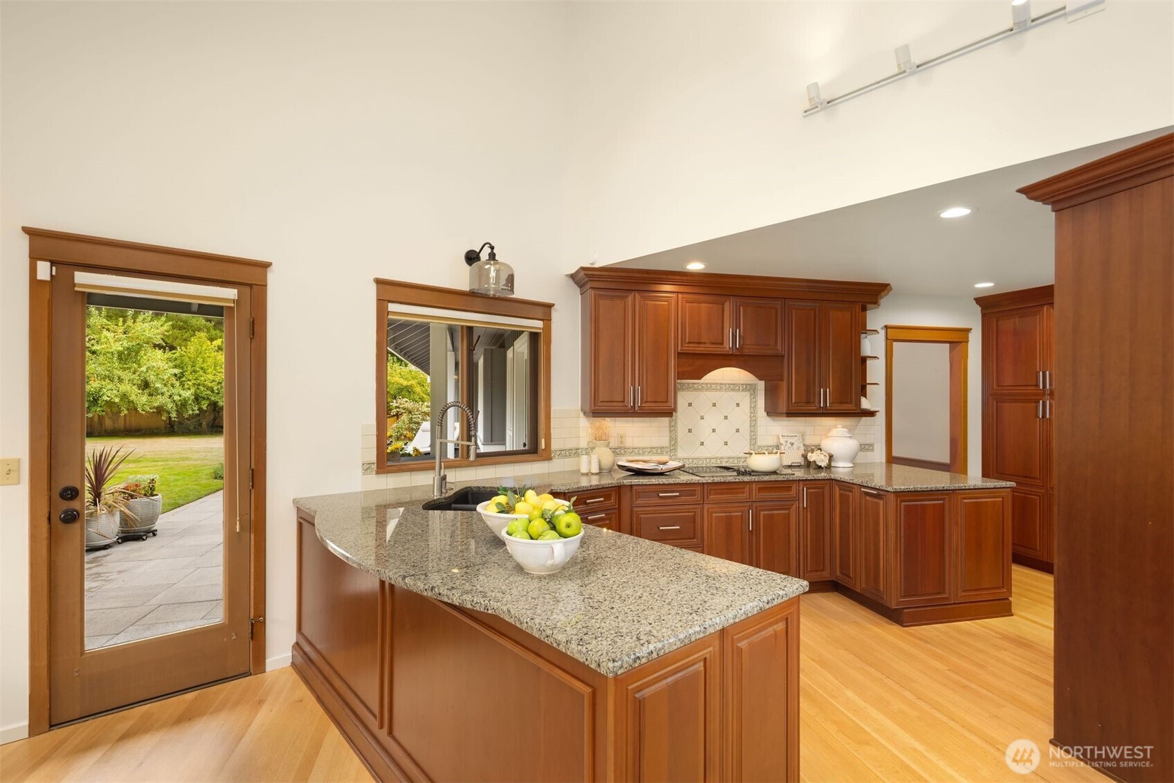 Large windows to take in views and a glass doors opens straight out into the lush garden.