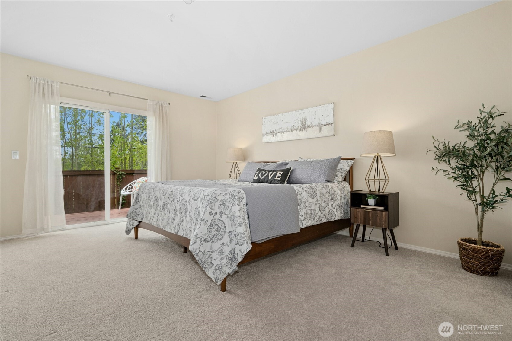 Spacious primary bedroom with private deck.