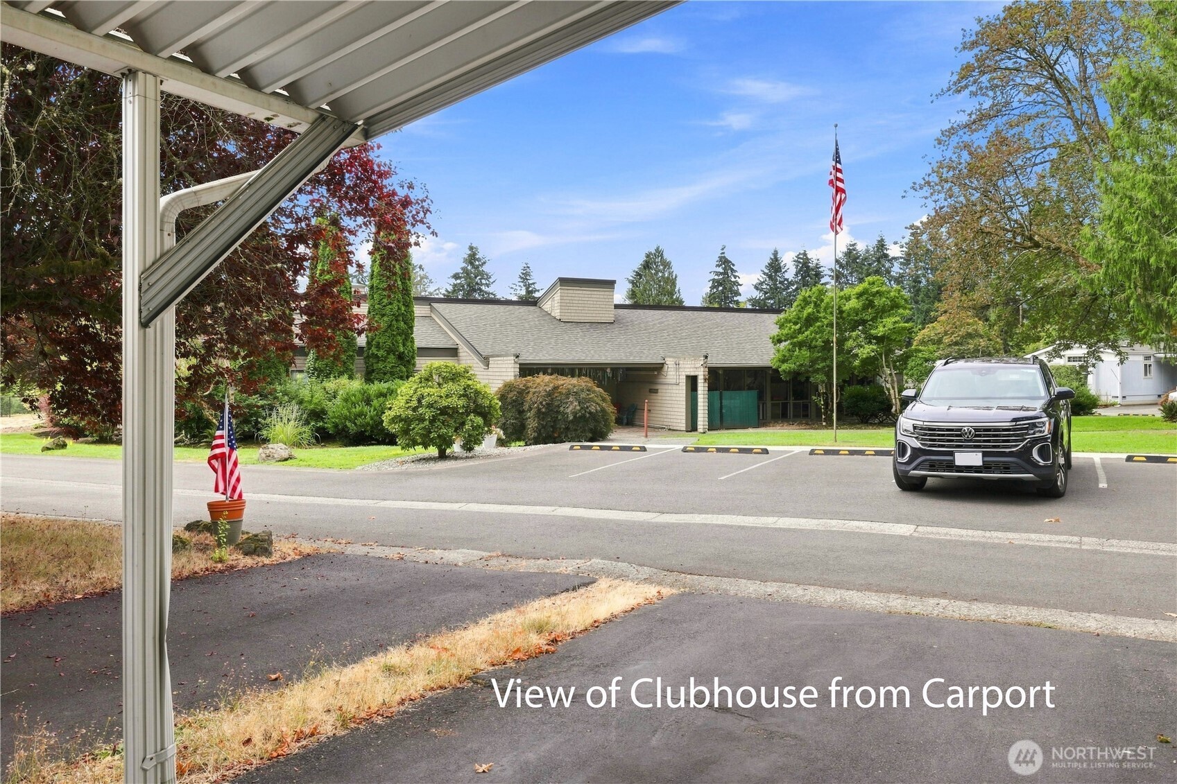 What a fabulous location. Not only is the clubhouse with it's many activities & amenities is across the street from this lovely home, you will also have access to a lot of parking spaces for your guests.