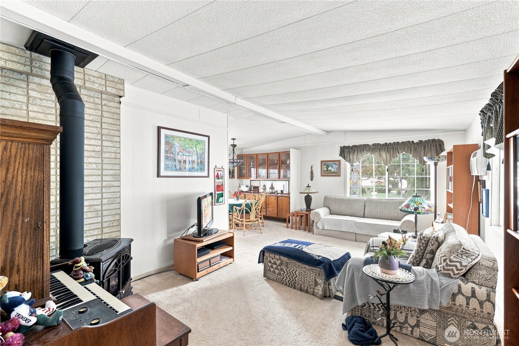 The charming dining area is seen from this view of the living room.