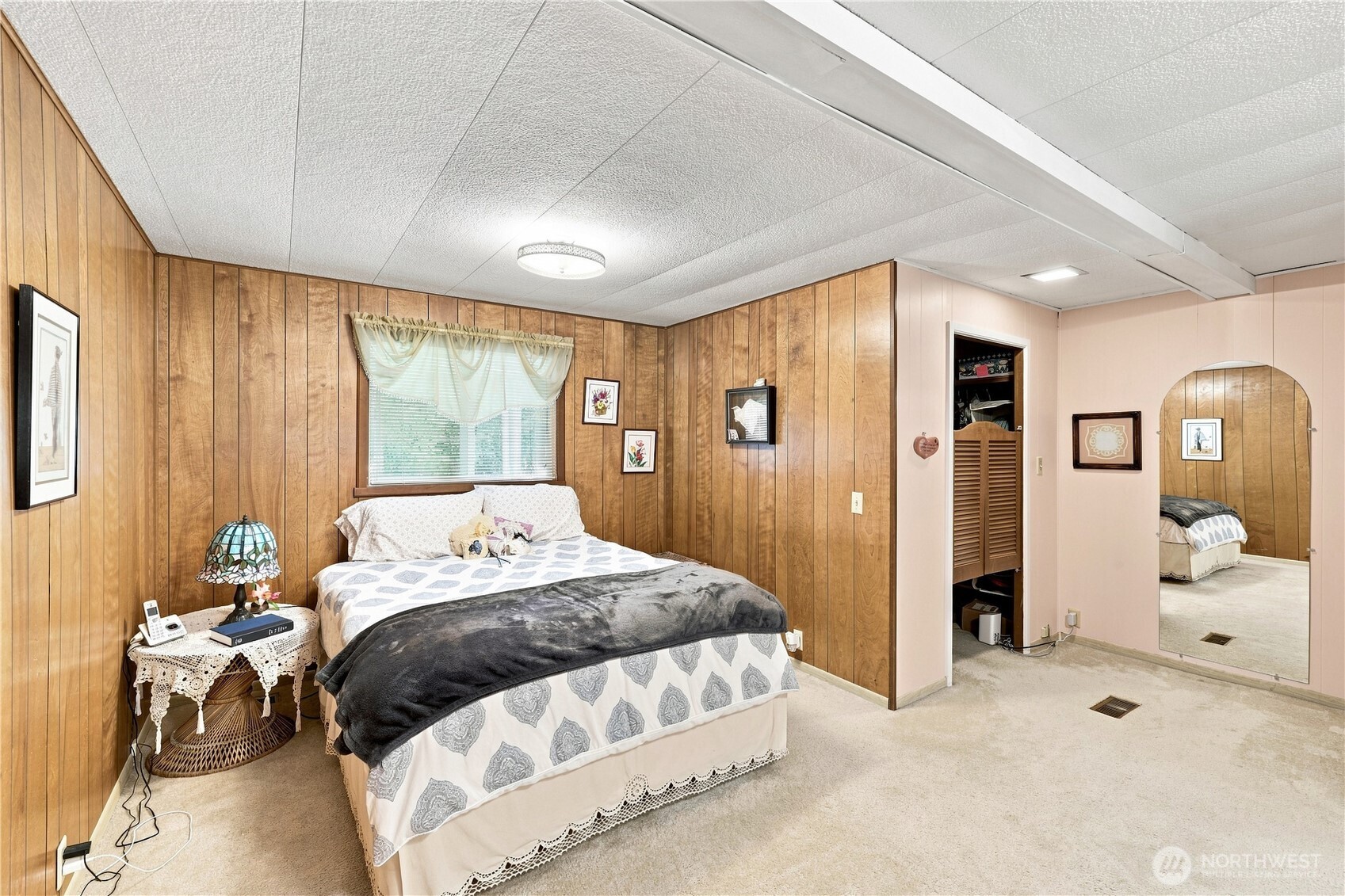 Spacious primary bedroom has a walk-in closet.