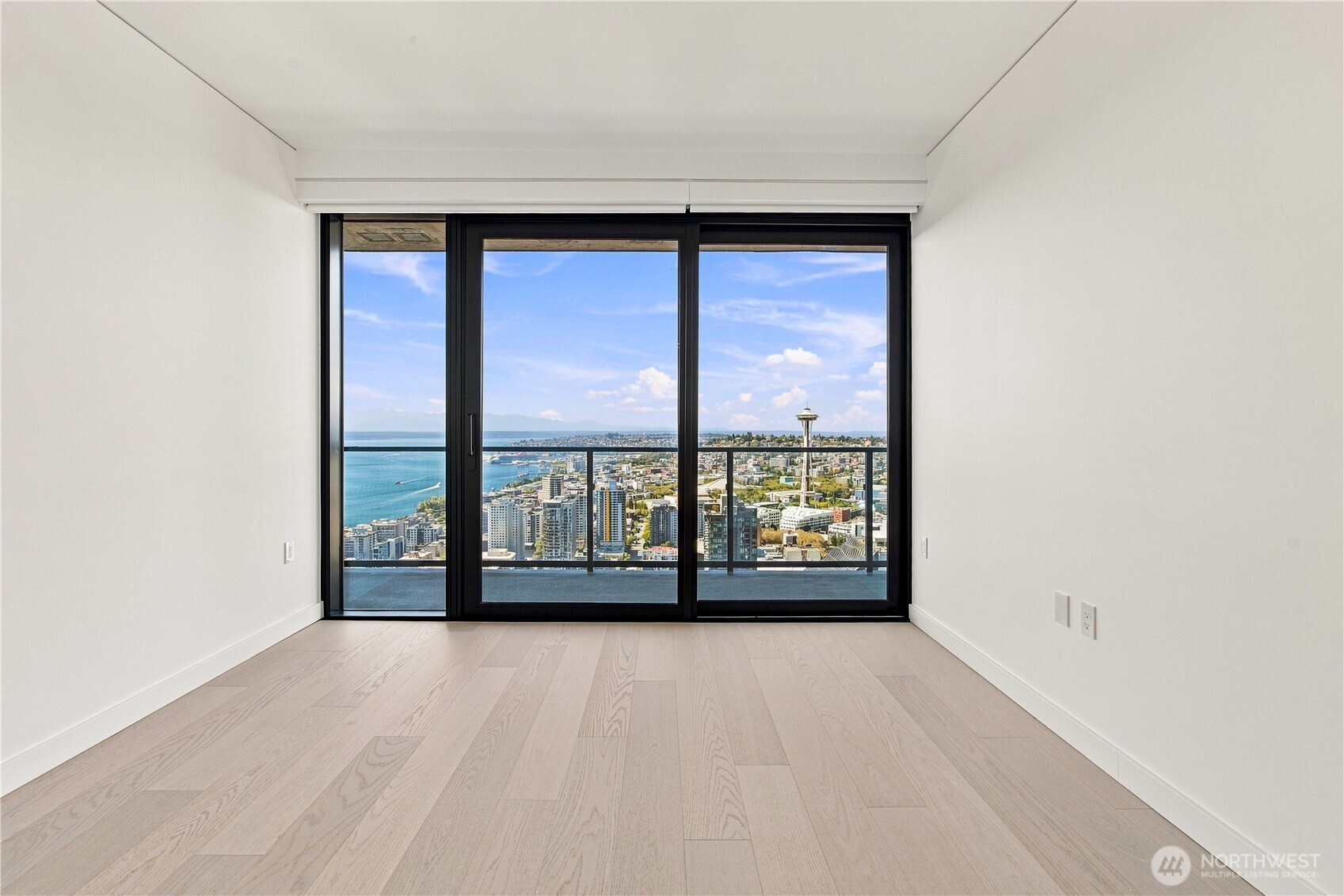 A serene third bedroom with coveted waterfront exposure—an elegant retreat for overnight guests or a private, independent space for a family member.