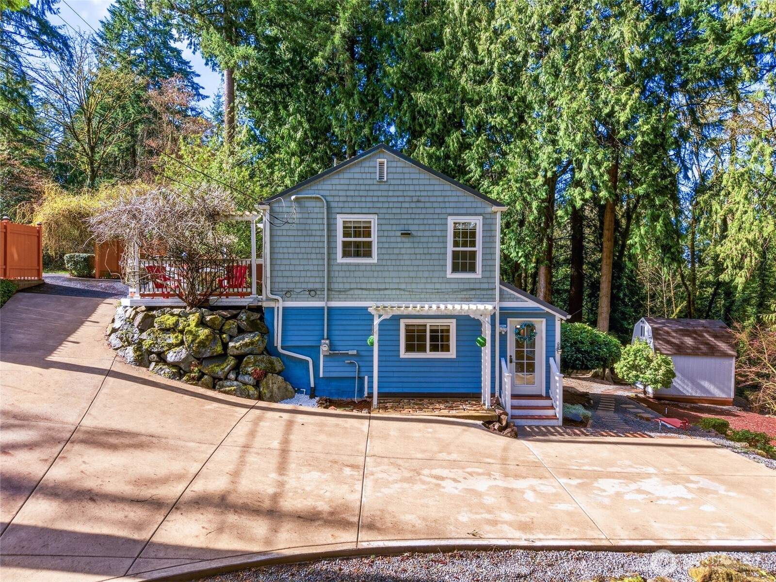 Another gorgeous view from the side of the house or remove the fence and expand the driveways further.