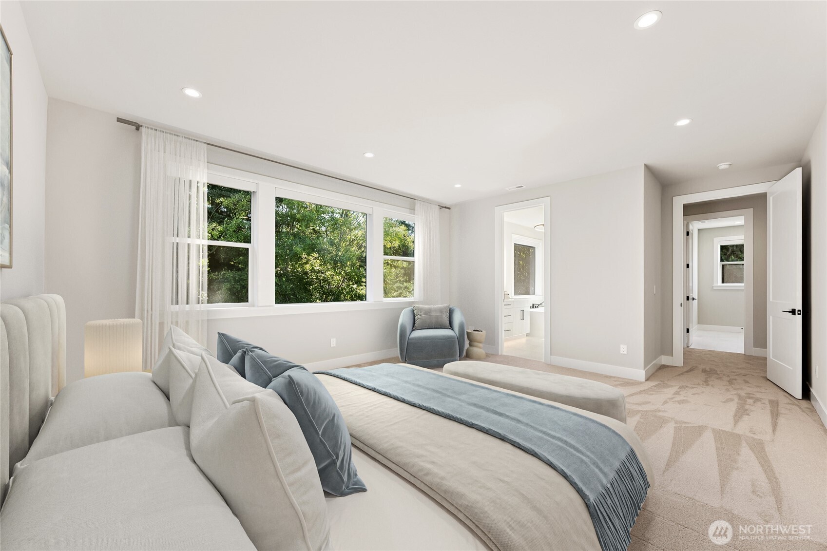 Another view of the spacious primary, highlighting generous space and private ensuite access. Virtually staged.
