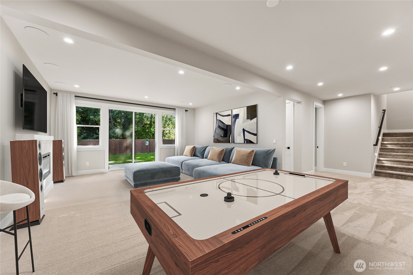 Spacious walkout lower-level basement offers additional living space with a bedroom and bathroom. Great for guest or multigenerational living. Virtually staged.