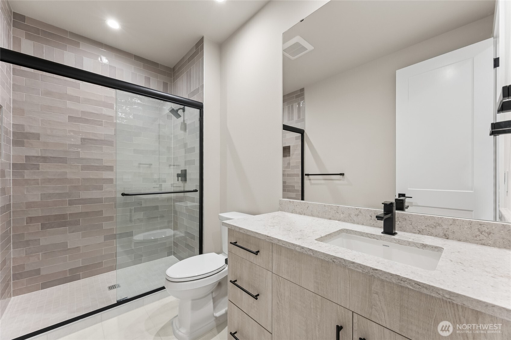 Beautifully finished 3/4 bathroom offers a toilet, sink and walk in shower for basement level.