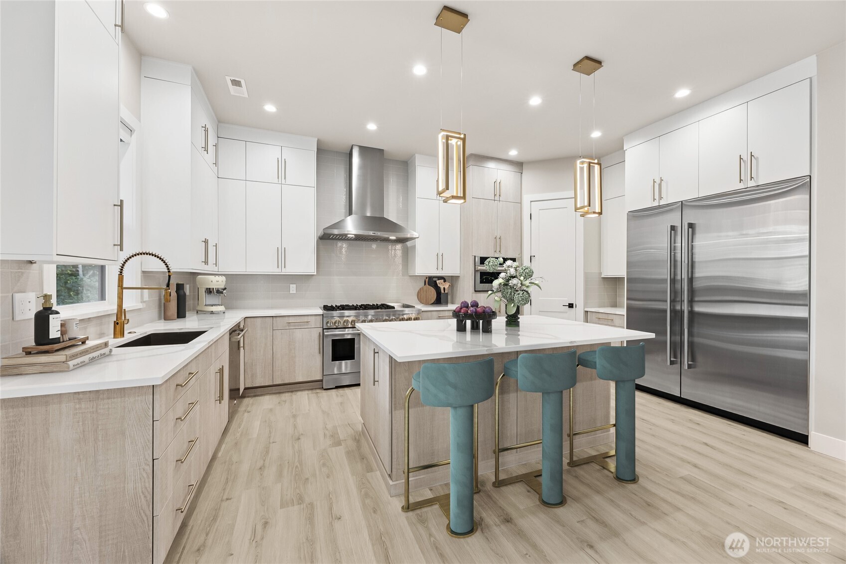 The heart of the home! This chef inspired kitchen featuring an oversized island, premium finishes, abundant cabinetry and spacious layout designed for everyday living and entertaining. Virtually staged.