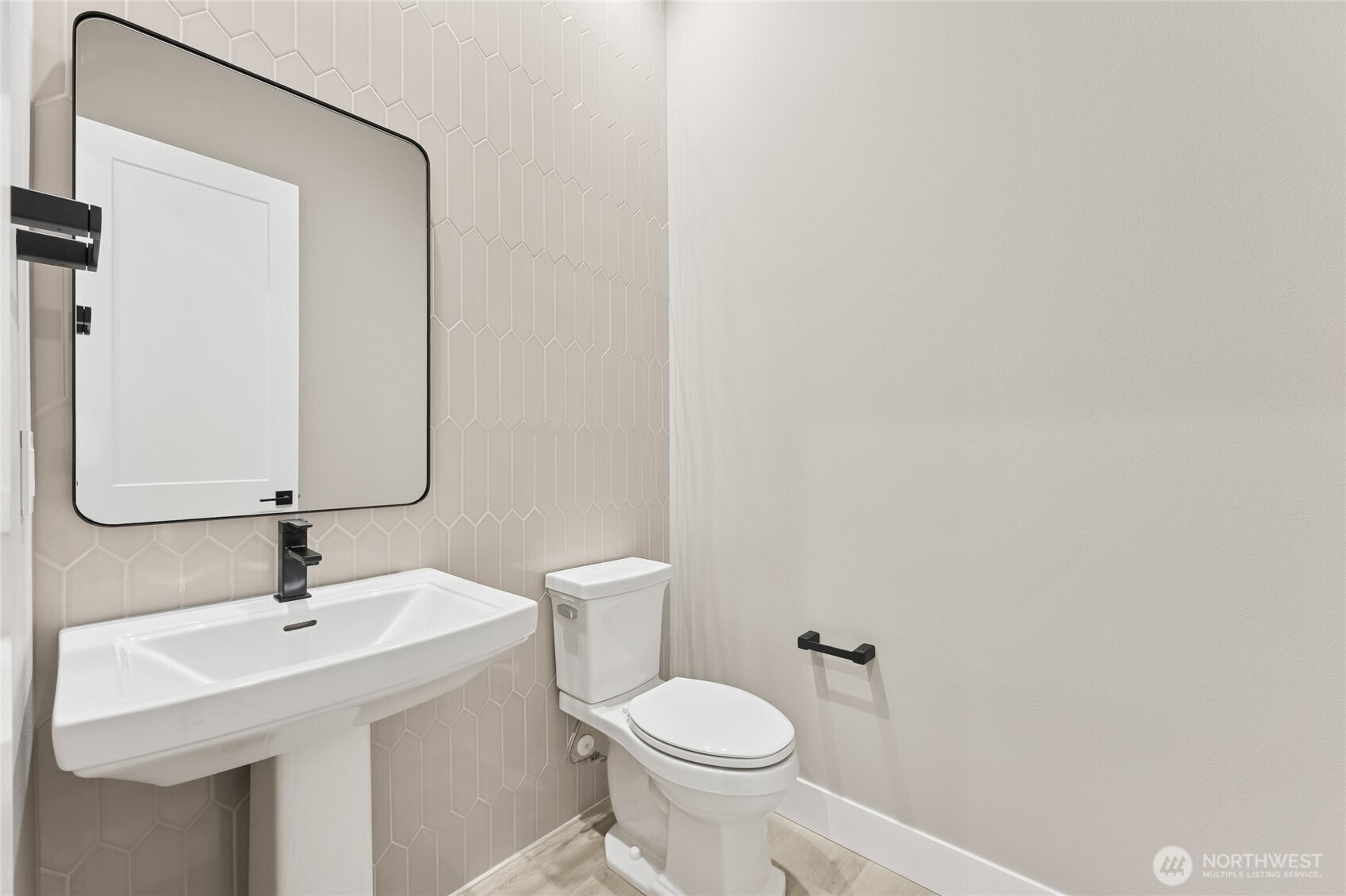Stylish main level powder room.