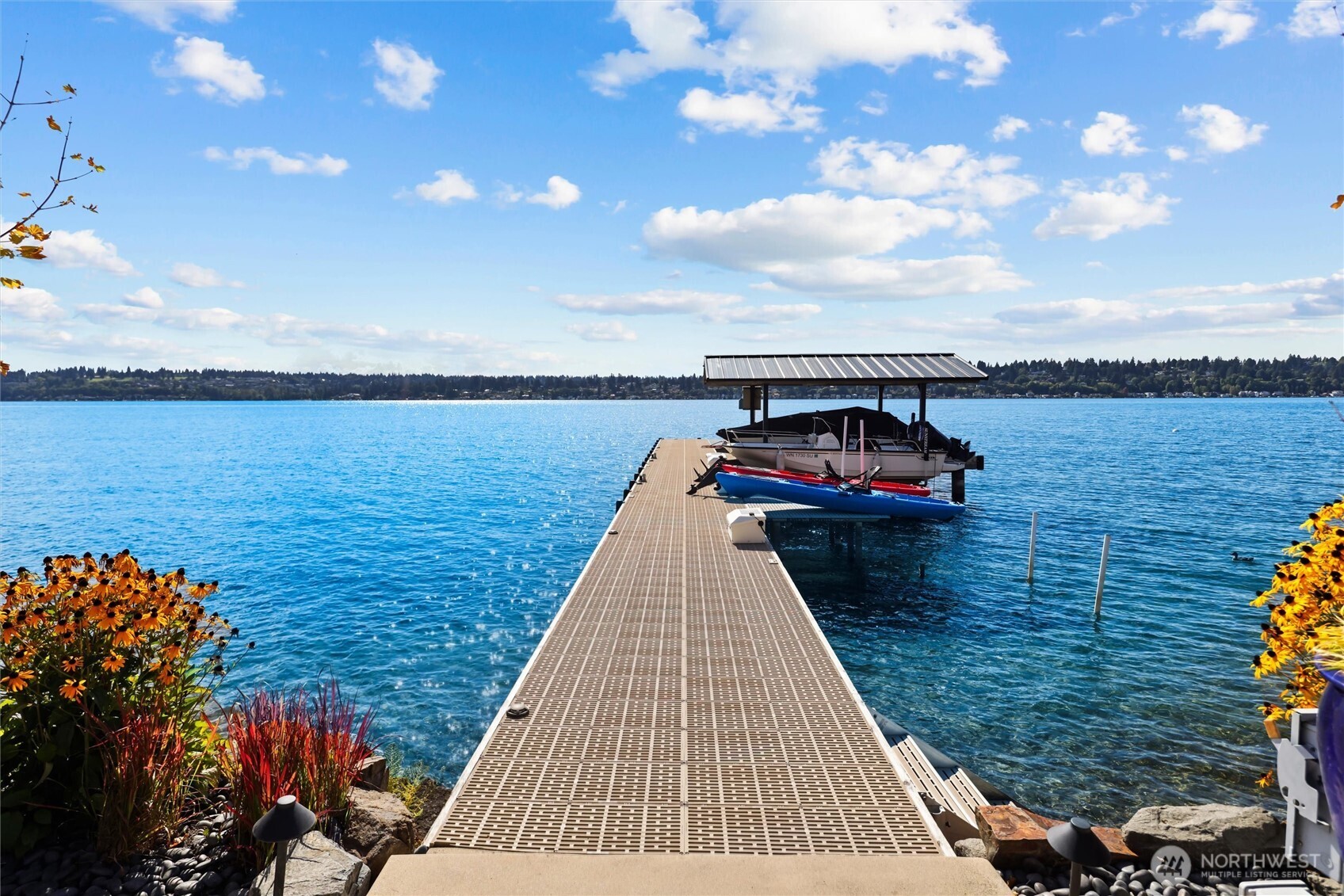 New 75-foot dock with 19’X13’ end for over-water entertaining, two new boat lifts, two jet ski lifts & two platform lifts and outstanding true deep-water moorage