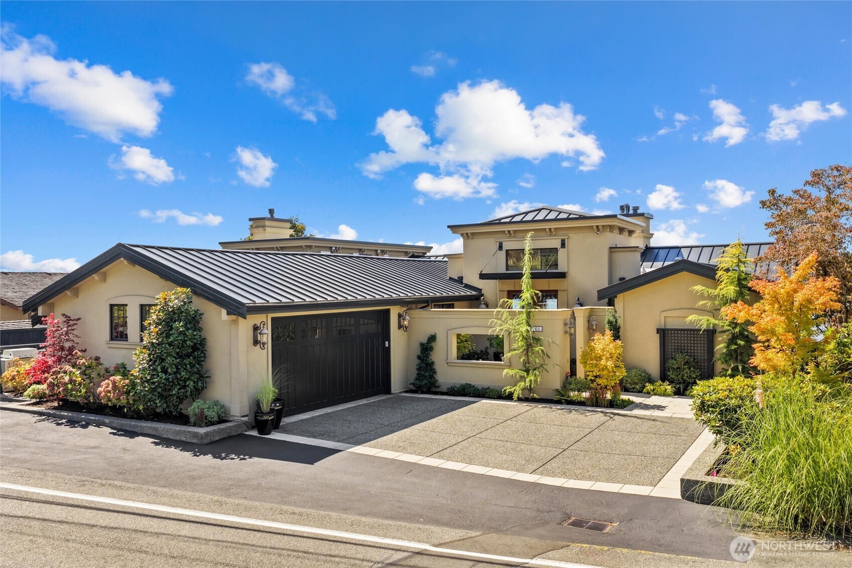 Oversized attached 2-car garage with epoxy floor and 6+ off-street parking spots on the newly resurfaced asphalt driveway