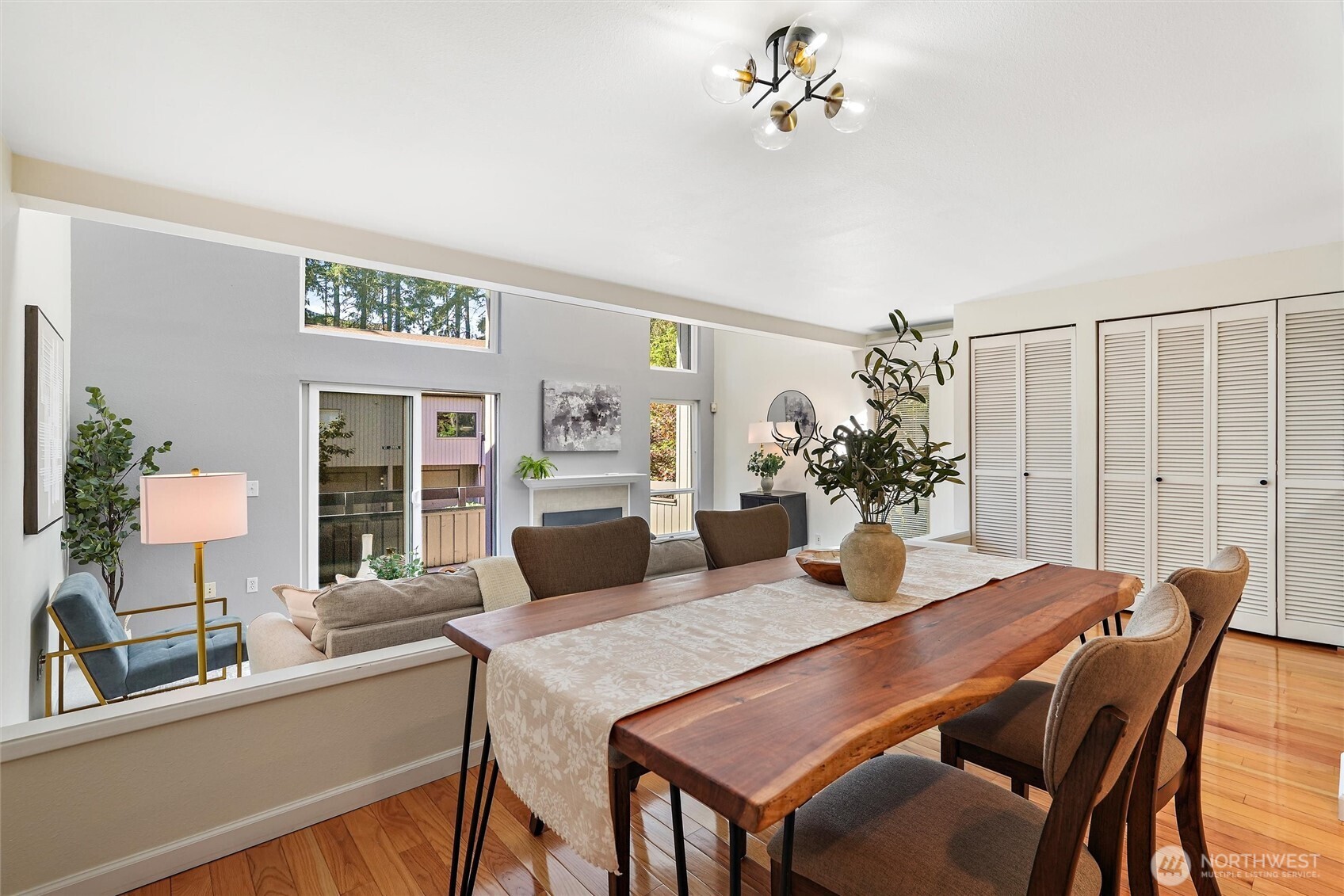 Kitchen with abundant natural light, light wood cabinetry, and stainless steel appliances