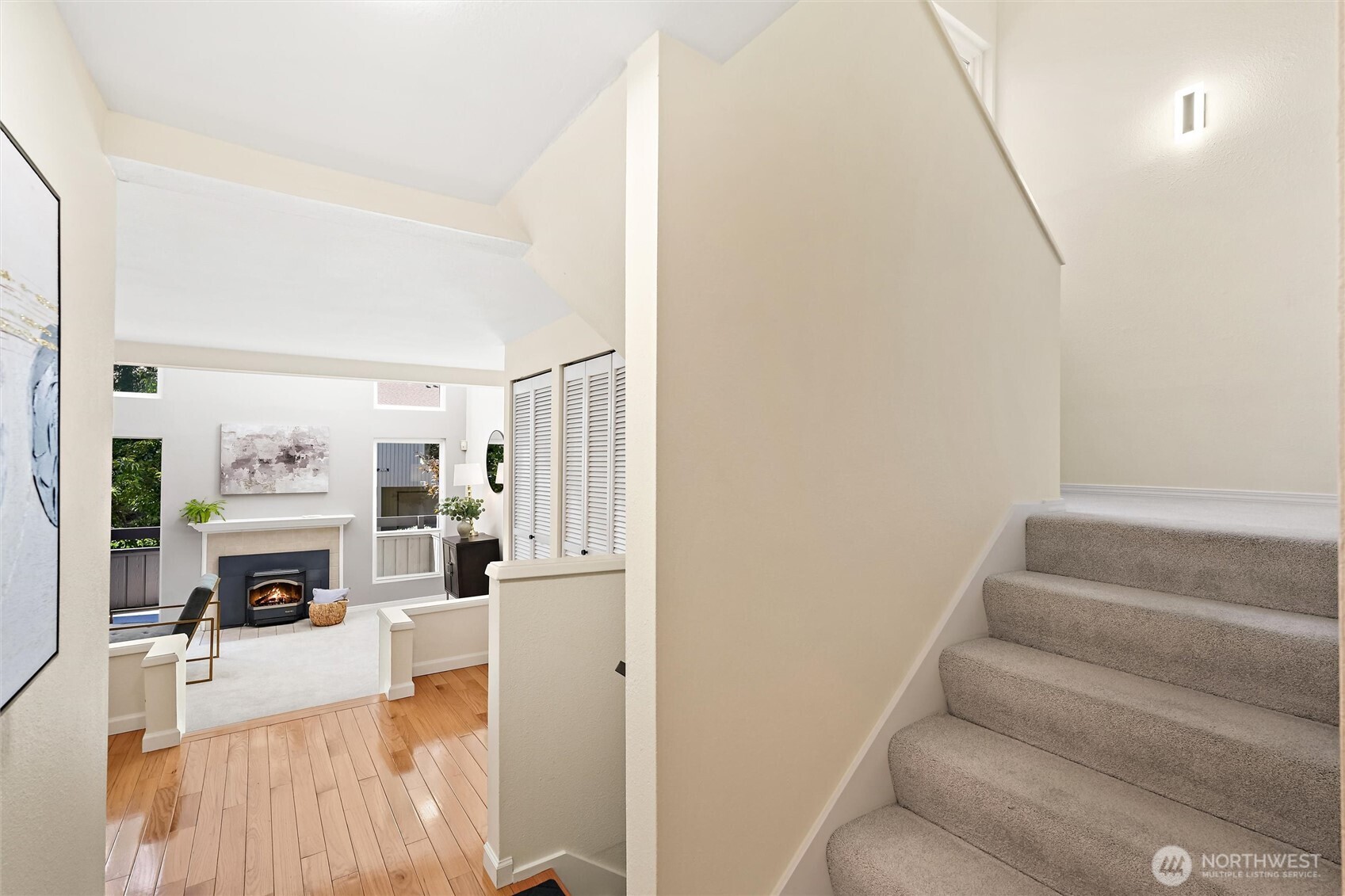 Primary bedroom with abundant natural light and neutral finishes.