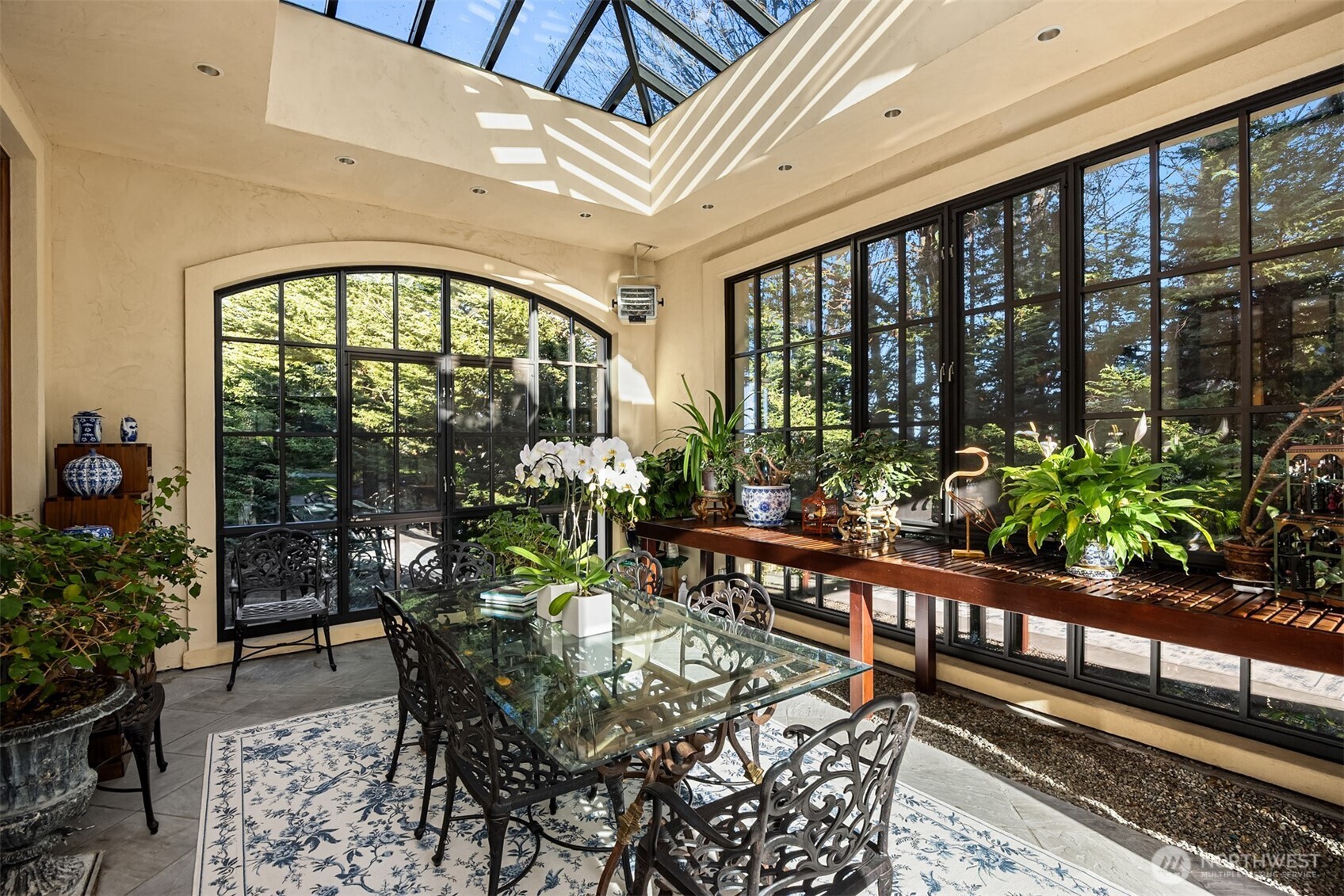 Conservatory with open doors that flow into the garden