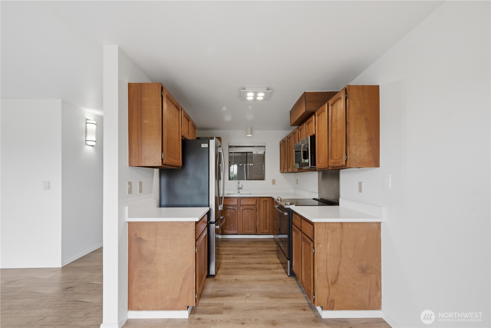 Galley kitchen with new quartz countertops