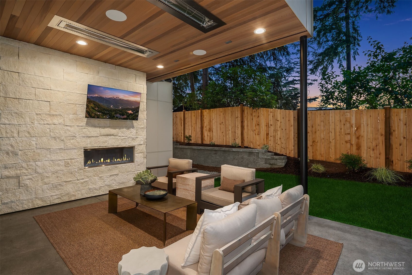 Outdoor covered living area with fireplace